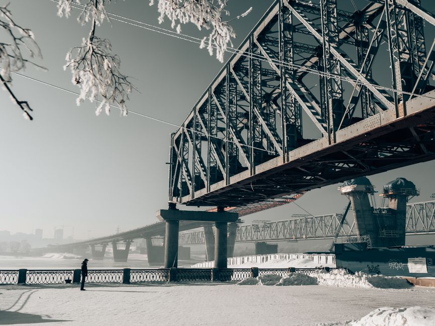 A striking unfinished railway bridge in snowy Novosibirsk, Russia, during winter.